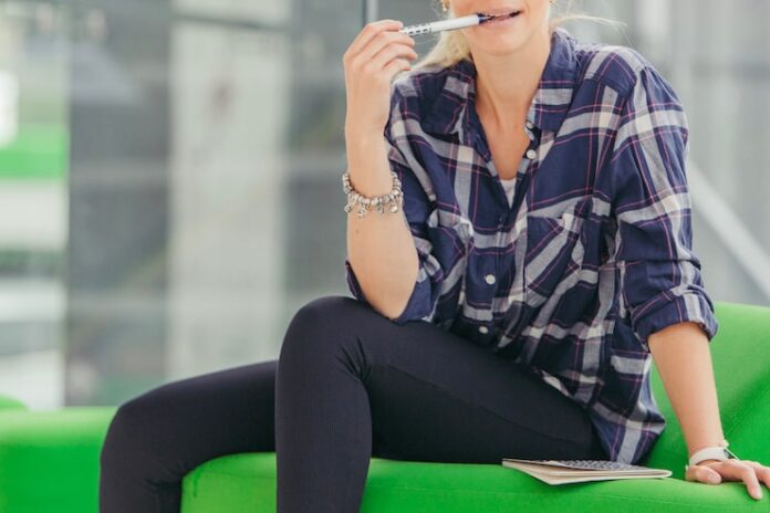 woman-biting-pen_23-2147679070